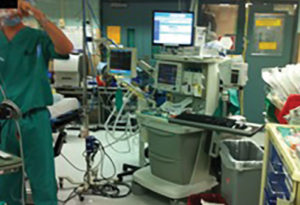 Figure 1: Photo of typical busy operating room displaying clutter, crowded conditions, and use of multiple pieces of equipment that increase the likelihood of pathogen transmission. Photo by L. S. Munoz-Price, MD, PhD.