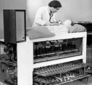 Figure 2: Michael Gordon demonstrating the original Harvey® cardiology simulator. Reused with permission from Cooper JB, Taqueti, VR. A brief history of the development of mannequin simulators for clinical education and training. Postgrad Med J. 2008; 84: 563–570.